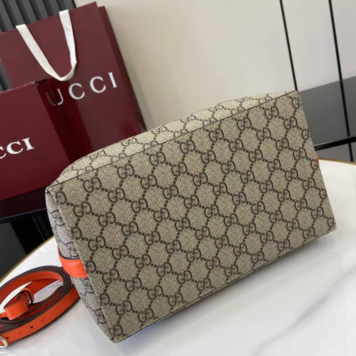 MEDIUM GG EMBLEM BUCKET BAG GUCCI